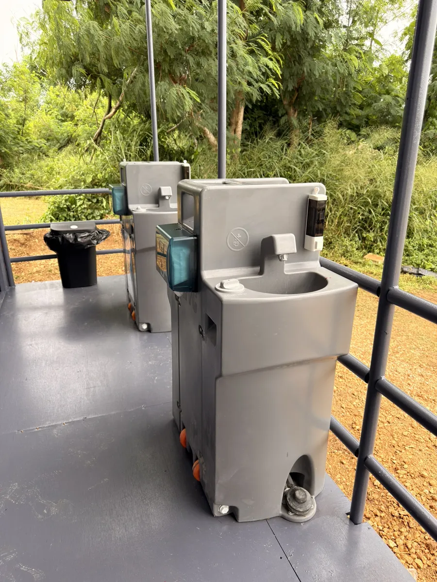 HYC portable hand-wash station on a restroom unit deck
